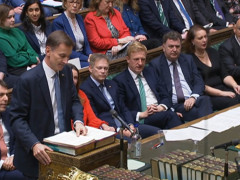 Britain Announces Higher Taxes and Spending Cuts
